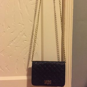 Used once before LuLu mini black&gold purse