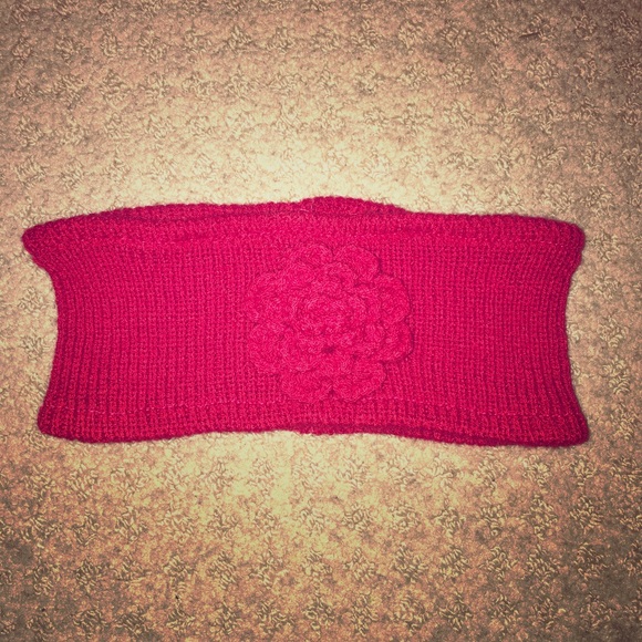 Red headband with sewn flower on the front