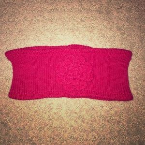 Red headband with sewn flower on the front