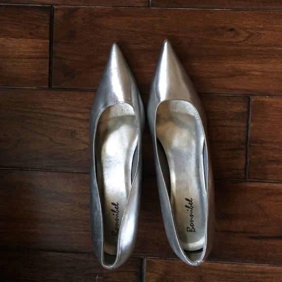 Silver pointy toe heels.