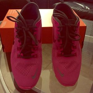 Pink and grey Nikes.