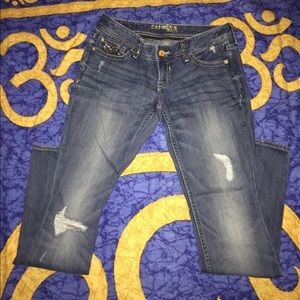 Slightly distressed jeans.