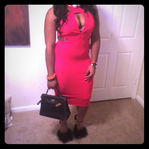 Red bodycon midi dress with a plunging decolte