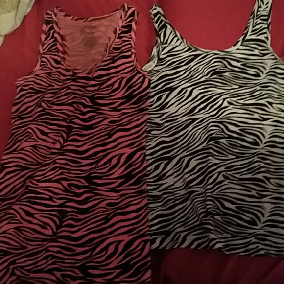 Two zebra print patterned tanks