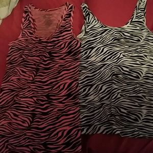 Two zebra print patterned tanks