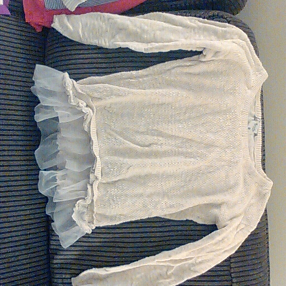 Fancy sweater type shirt.