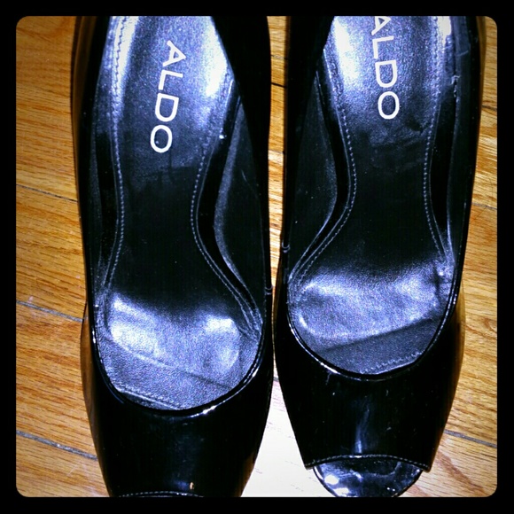 Black platform Aldo heels.