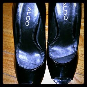 Black platform Aldo heels.