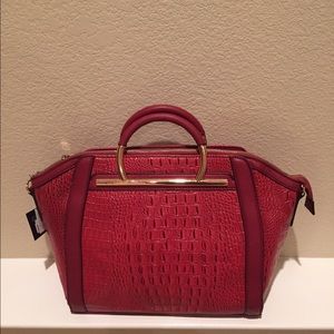 Red tote with faux croc design.