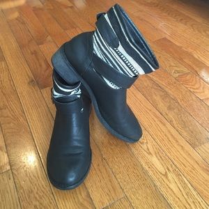 Black and white buckled boots