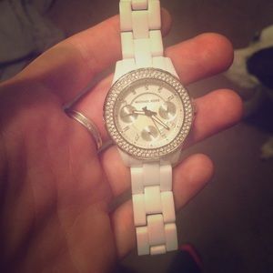 Small white Michael Kors watch.