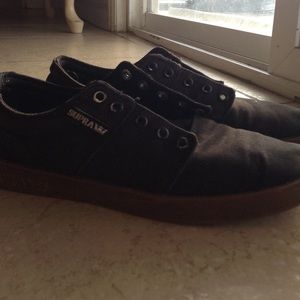 A pair of black supras