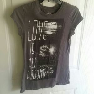 Beautiful NWOT "Love is all around" t-shirt
