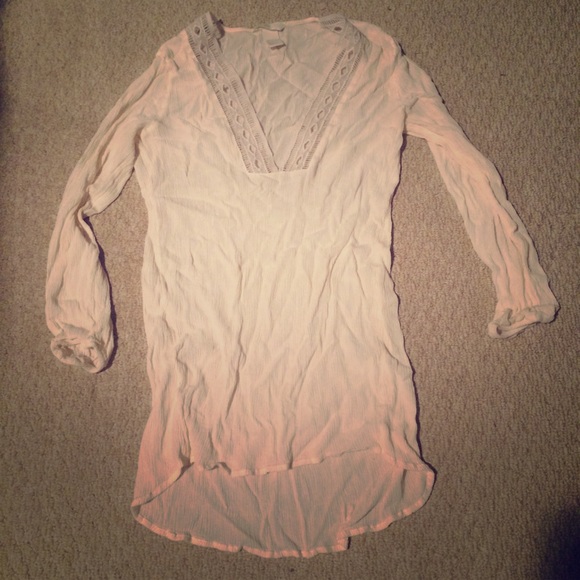 Cream top with lace detail around neck
