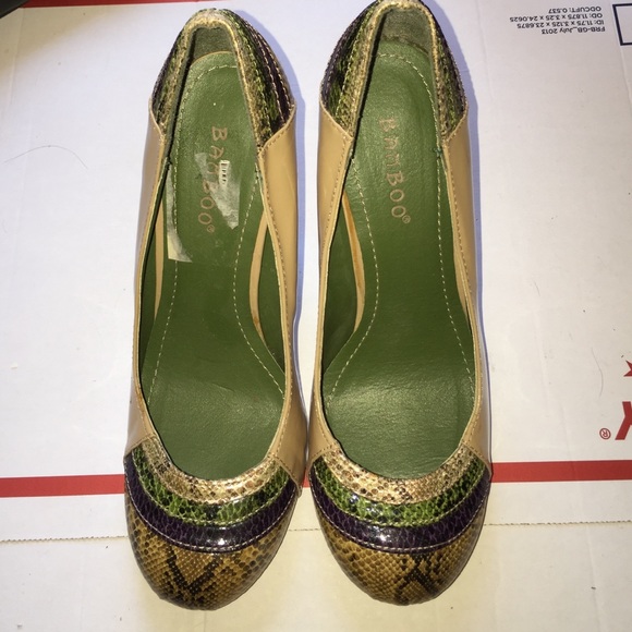 Tan heels. Patent with snakeskin print. Size 6