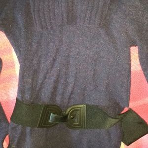 Cowl neck sweater with belt.
