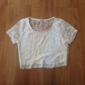 White lace crop top . Size large but fits a sm/md