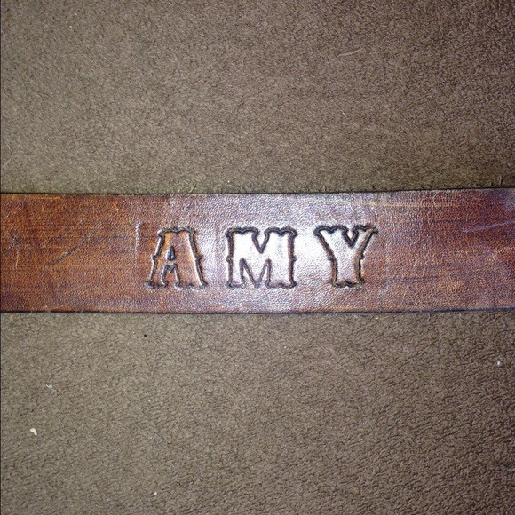 Leather belt says AMY with horses