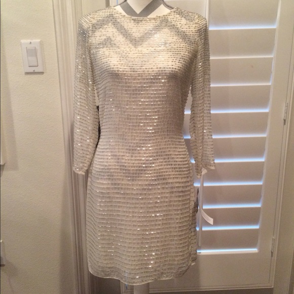 White mid length dress with silver beads