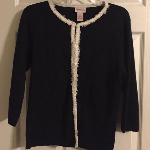 Black cardigan with white detail.