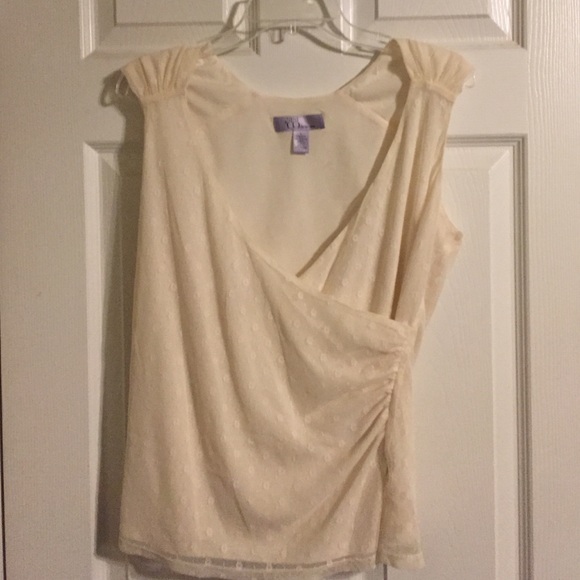 Cream lined, lace, sleeveless blouse.