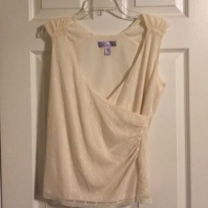 Cream lined, lace, sleeveless blouse.