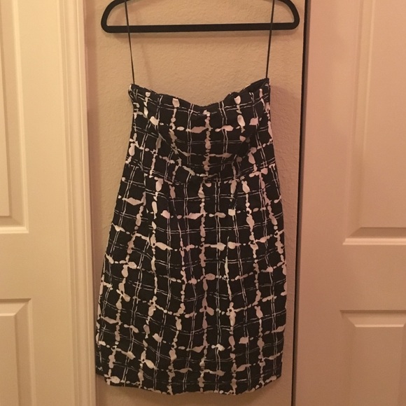 Black and white strapless dress.