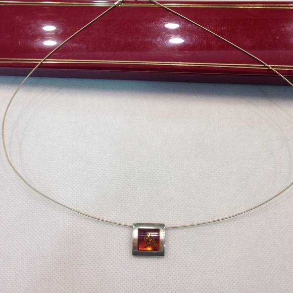 Real Romanian Amber in silver casing.