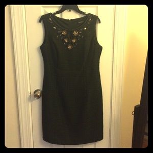 Forest green shift dress with embellishment.