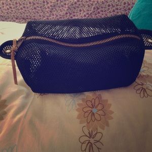 Brown and black , make-up bag by Urban Outfitters.