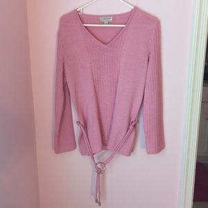 Light pink sweater top.