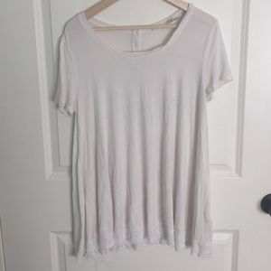 white flowy top with back buttons.