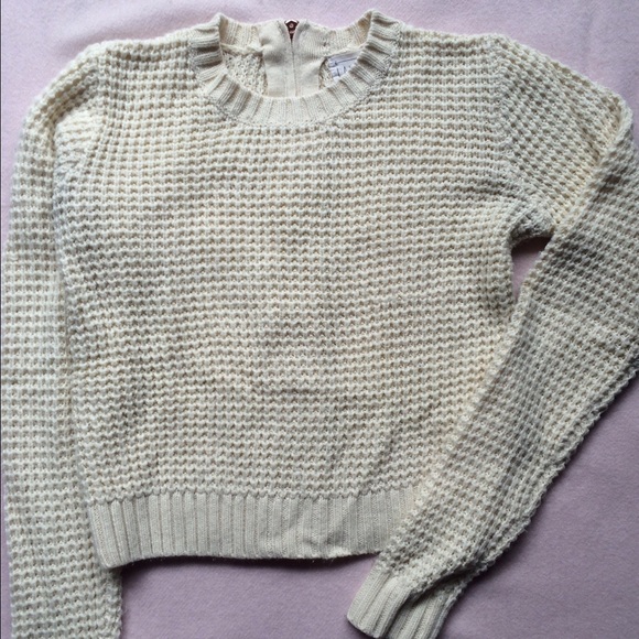 Cream color knit sweater with back zip. Size S.