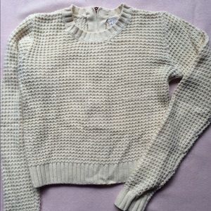 Cream color knit sweater with back zip. Size S.
