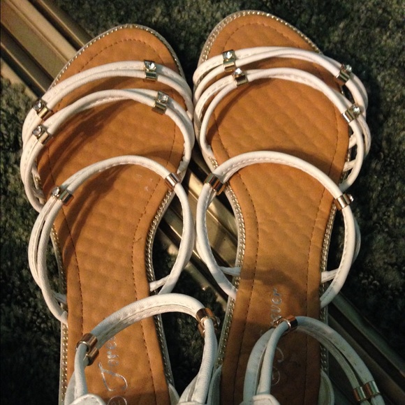White sandals with gold detailing
