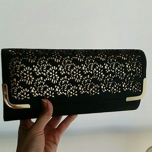 Black vegan leather with gold detail clutch