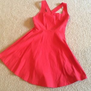Coral sleeveless dress with criss cross bow back