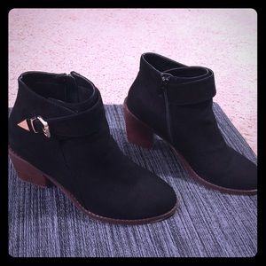 Black boots with gold buckle