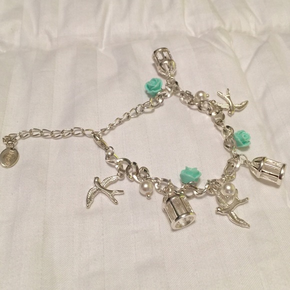 Silver plated bird, 🌹 and birdcage bracelet.