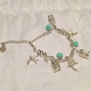 Silver plated bird, 🌹 and birdcage bracelet.