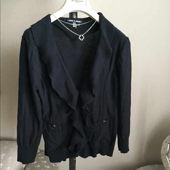 100% cotton ruffle front knit top with snap front