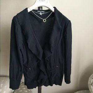 100% cotton ruffle front knit top with snap front