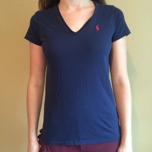 Blue v-neck polo.
