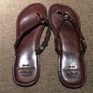 Brown leather flip flops