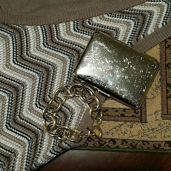 Silver tone cigarette case.