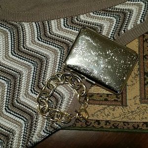 Silver tone cigarette case.