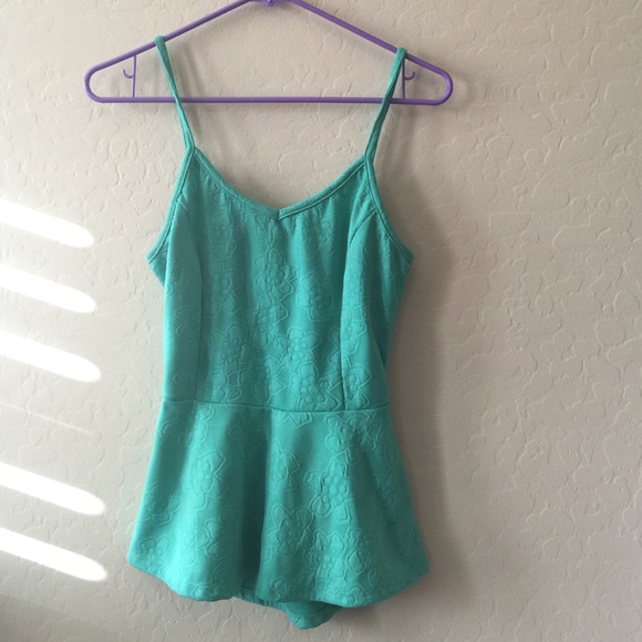 Green Peplum top with back cutout