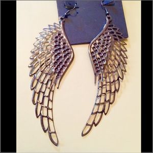 Gunmetal tone. Oversized angel wing earrings