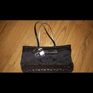 Black Coach tote with patent leather accents