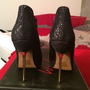 Black lace bootie with gold stiletto heel!